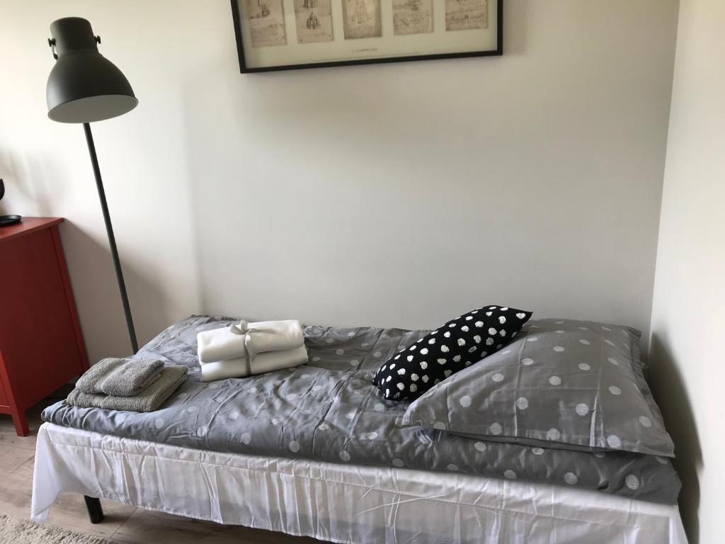 Postel nebo postele na pokoji v ubytování Apartamenty Legionów
