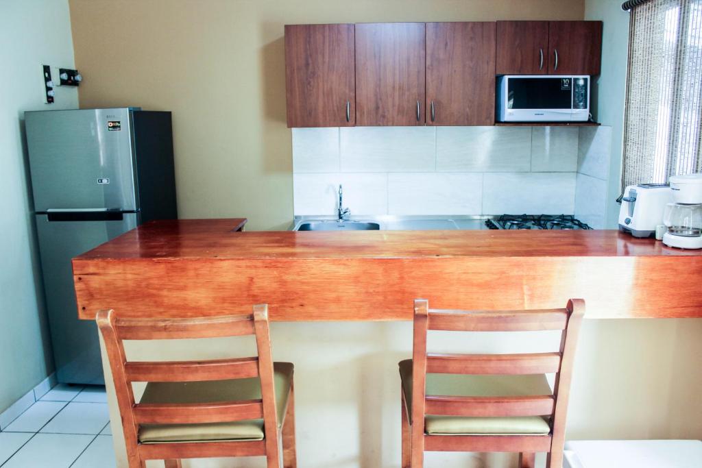 Kuchyň nebo kuchyňský kout v ubytování Coconut Inn