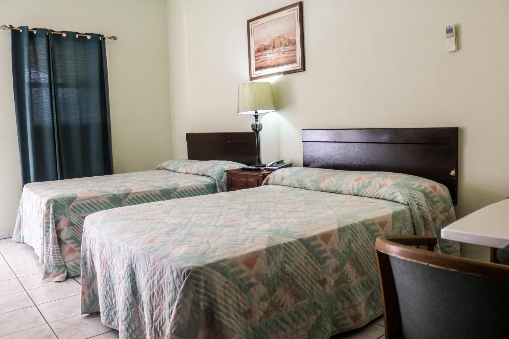 Postel nebo postele na pokoji v ubytování Coconut Inn