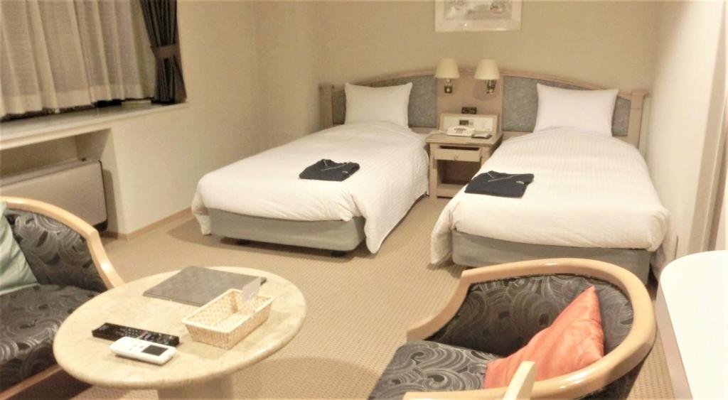 Postel nebo postele na pokoji v ubytování Hotel Cypress Karuizawa
