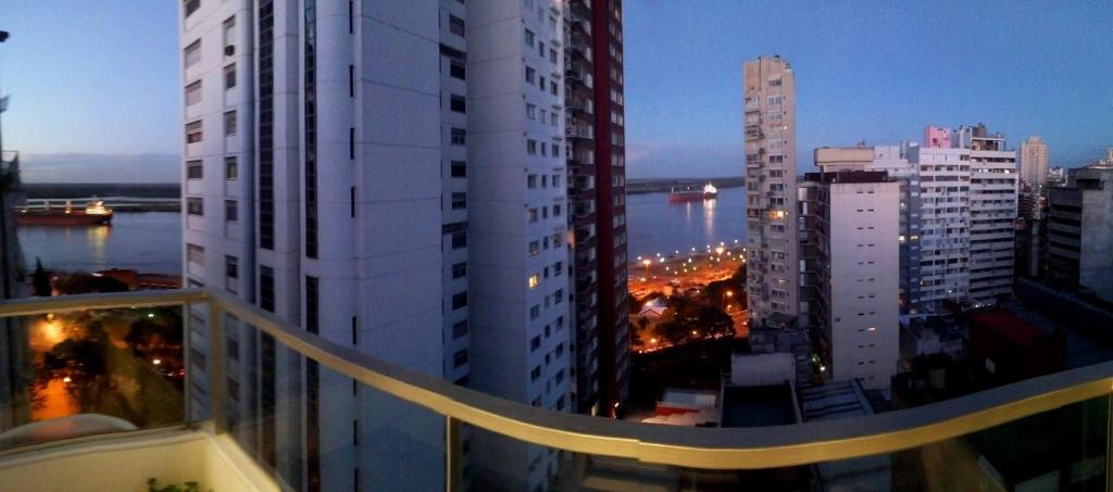 a view of a city from a balcony of a building at Parque España Rio in Rosario