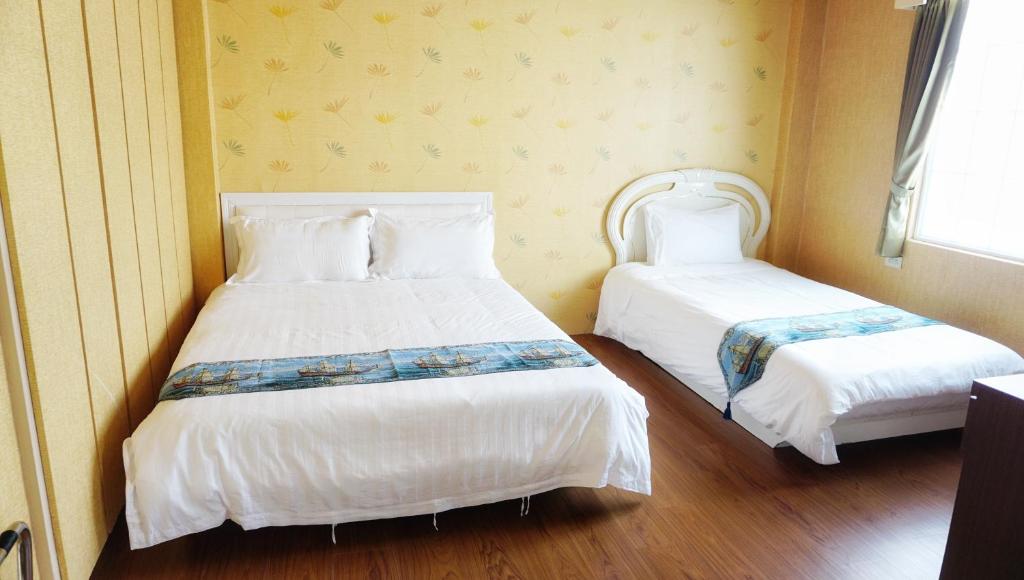 Llit o llits en una habitació de Red Roof B&B