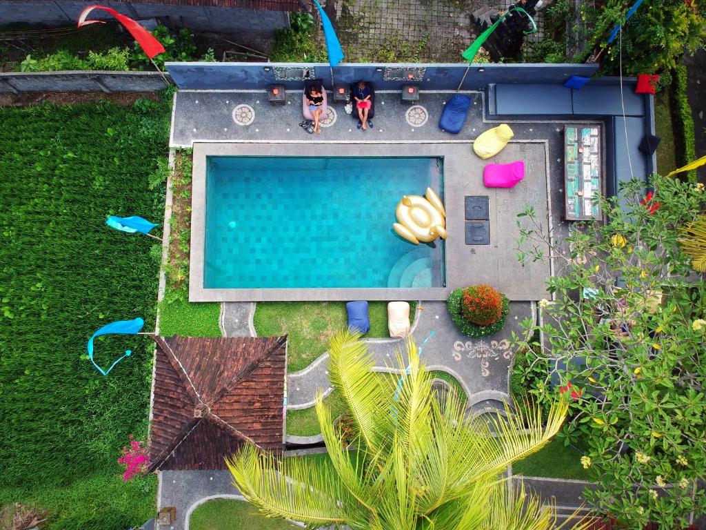 an aerial view of a backyard with a swimming pool at In Da Lodge in Ubud