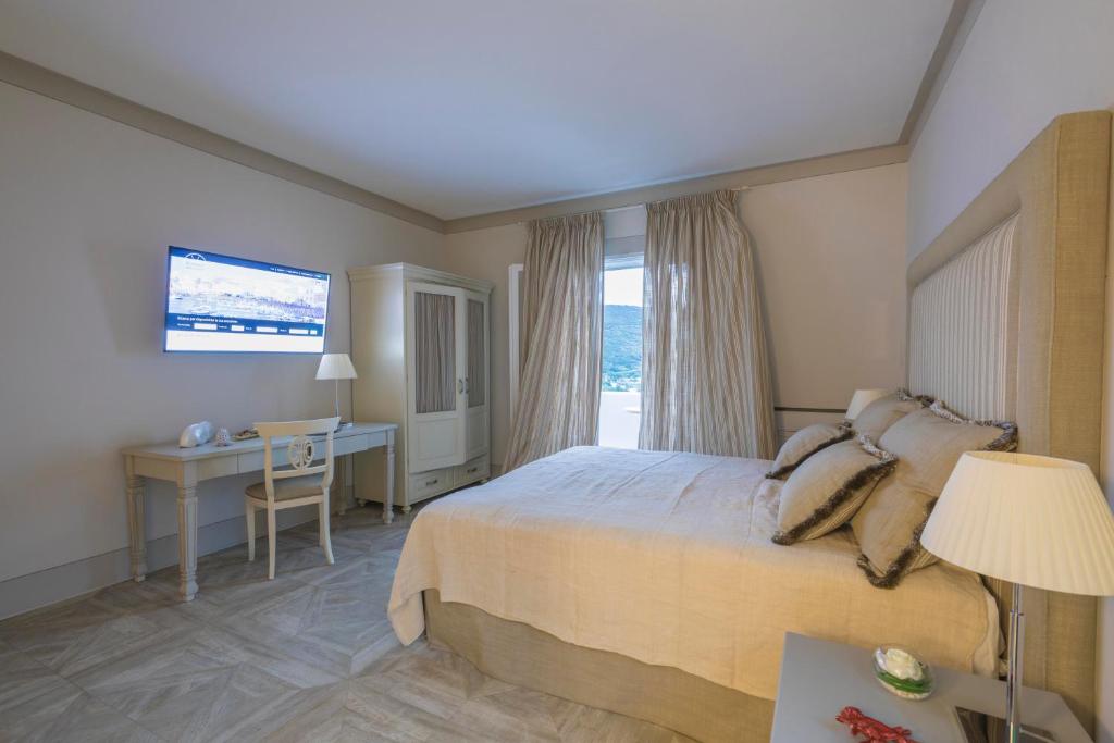 Postel nebo postele na pokoji v ubytování Maridea Casa Vacanza- Le Alcove sul Mare Suites