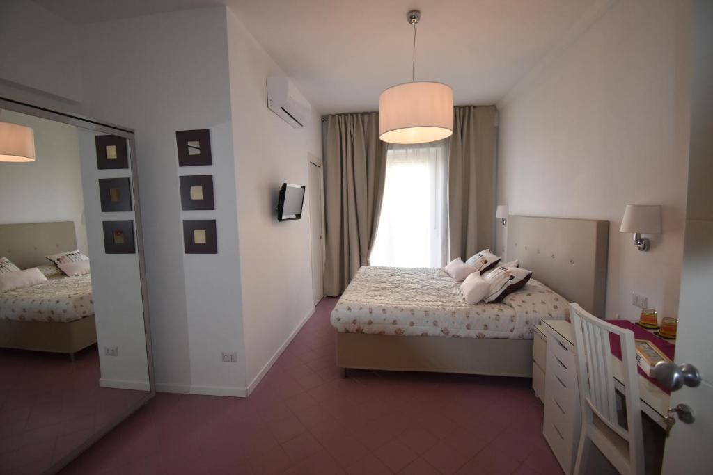 Posteľ alebo postele v izbe v ubytovaní A Sorrento B&B
