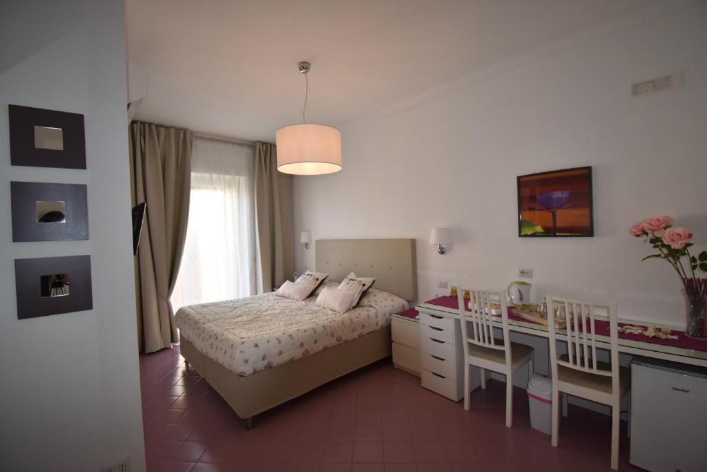 Posteľ alebo postele v izbe v ubytovaní A Sorrento B&B