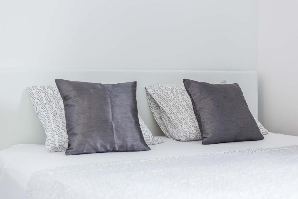 Кровать или кровати в номере Apartments Tonka Centar