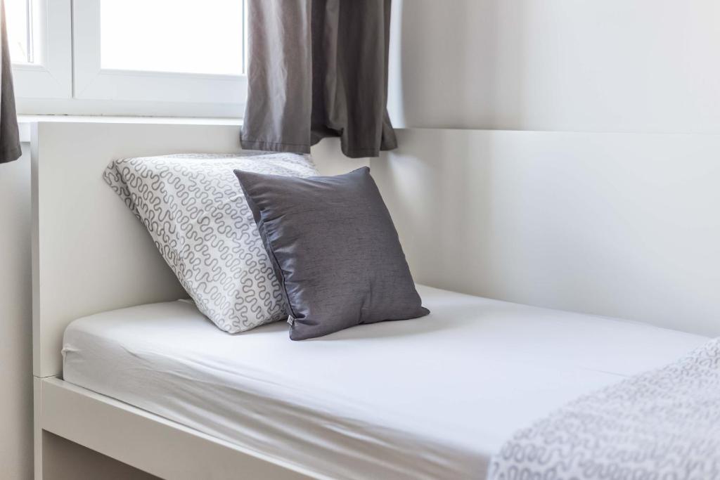 Кровать или кровати в номере Apartments Tonka Centar