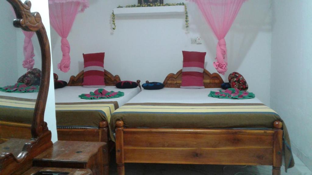 Postel nebo postele na pokoji v ubytování Kalana Homestay