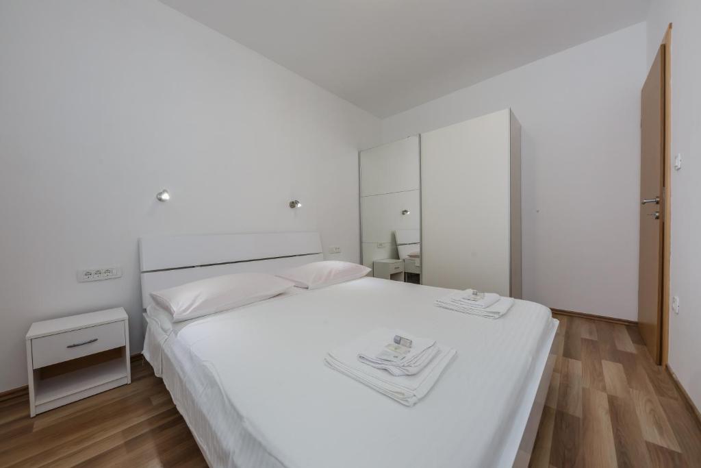 Posteľ alebo postele v izbe v ubytovaní Apartments Selak