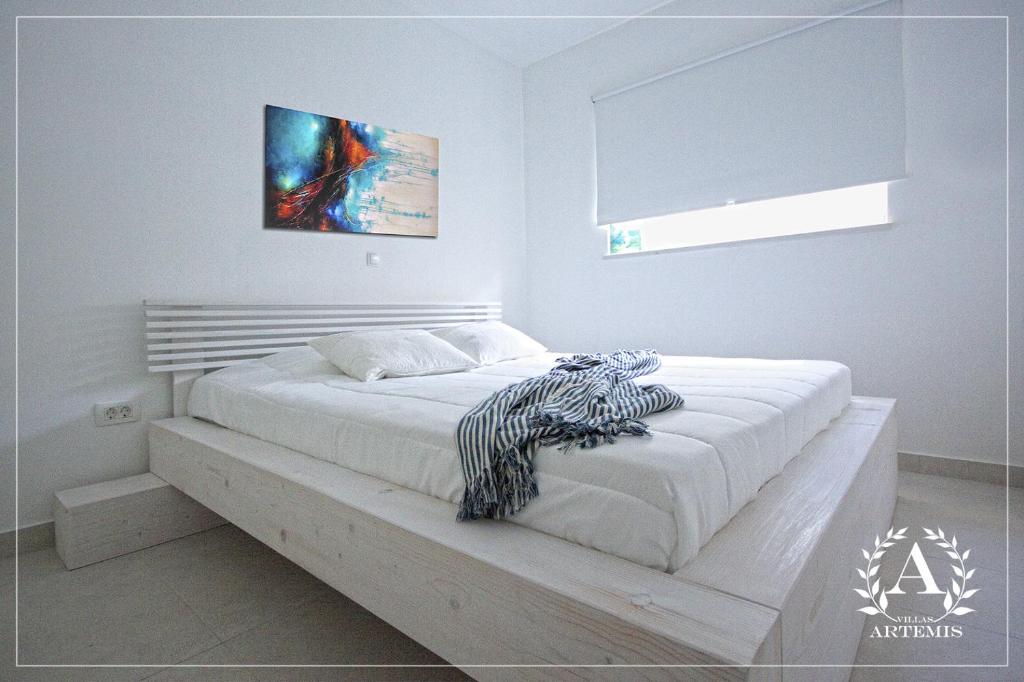 Postel nebo postele na pokoji v ubytování Villa Artemis