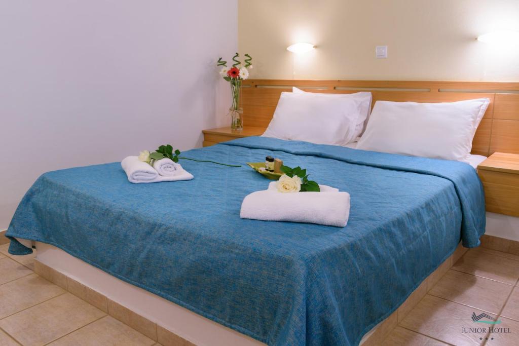 Postel nebo postele na pokoji v ubytování Junior Hotel