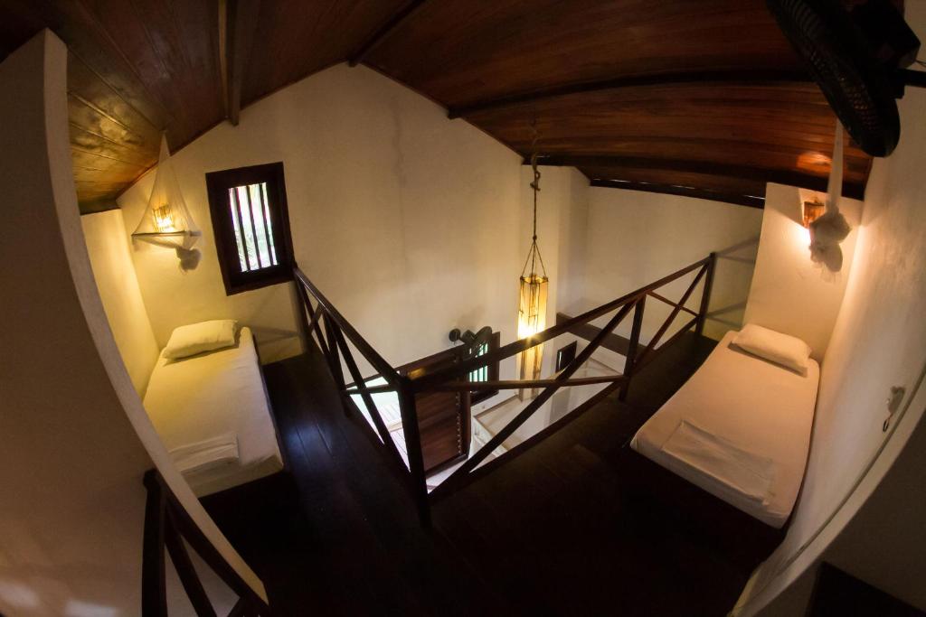 Postel nebo postele na pokoji v ubytování Pousada Pais Tropical