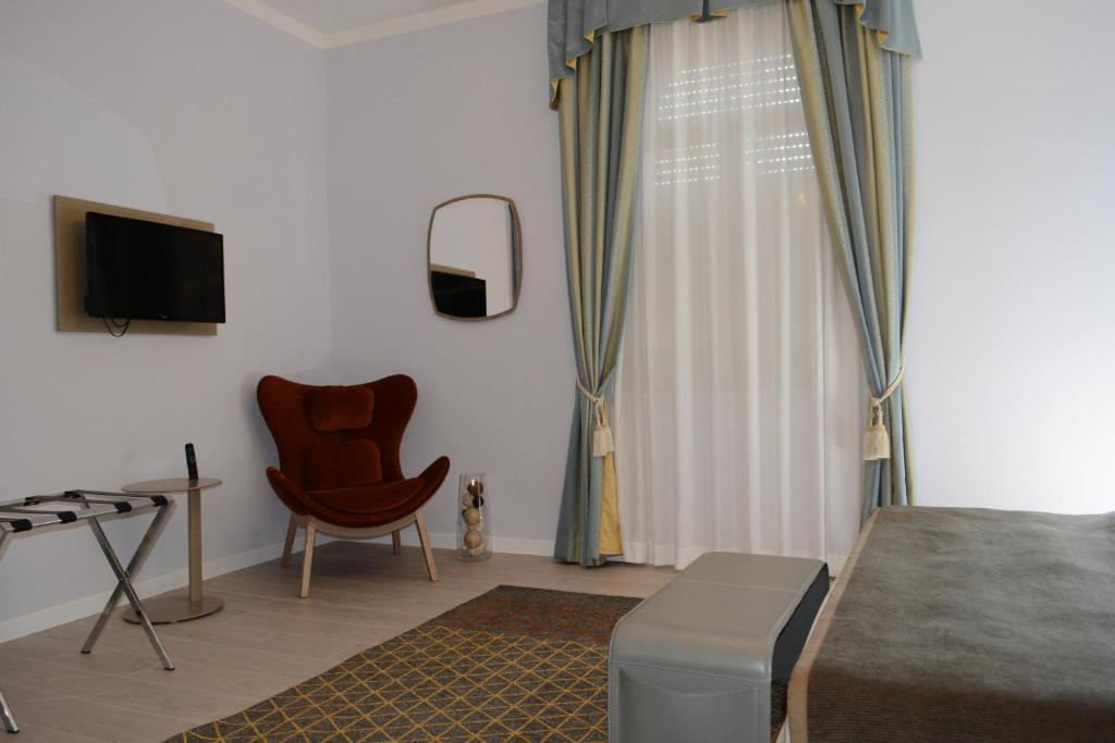 TV a/nebo společenská místnost v ubytování Les 7 Suites Erica