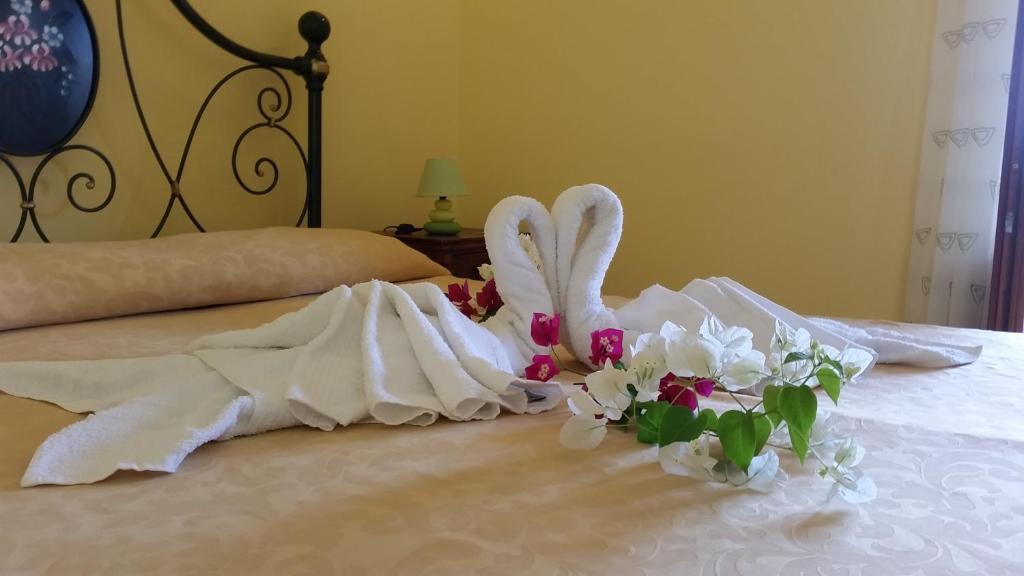 A bed or beds in a room at B&B Villa Maristella