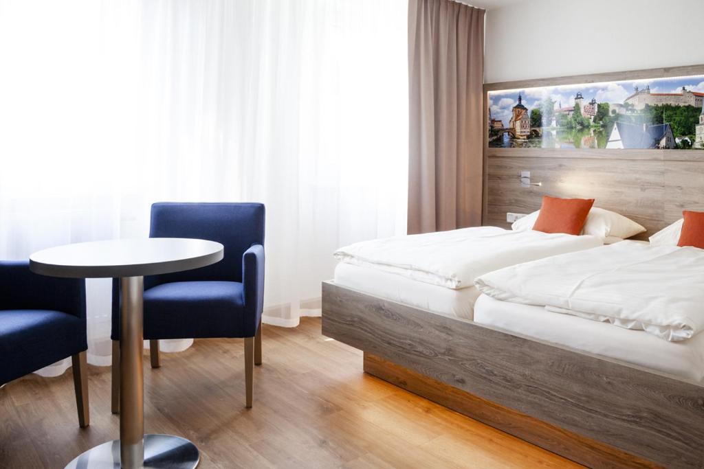 Postel nebo postele na pokoji v ubytování Hotel Ertl