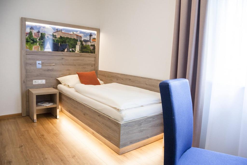 Postel nebo postele na pokoji v ubytování Hotel Ertl