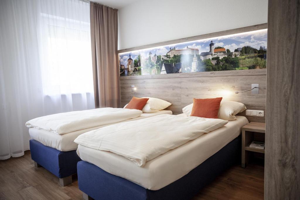 Postel nebo postele na pokoji v ubytování Hotel Ertl