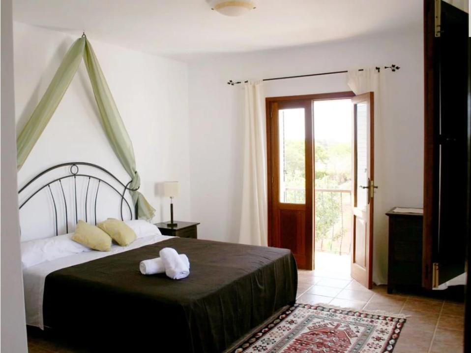 A bed or beds in a room at Villa Can Cosmi