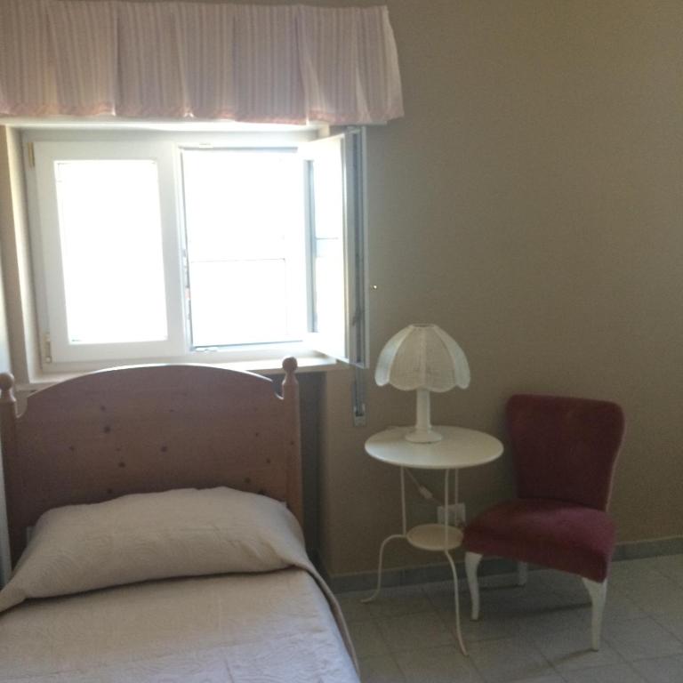 Postel nebo postele na pokoji v ubytování Villa L'Ottagono con cucina parcheggio privato telecamerizzato e wifi