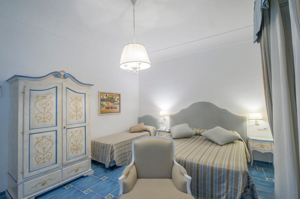 Postel nebo postele na pokoji v ubytování Hotel Pellegrino