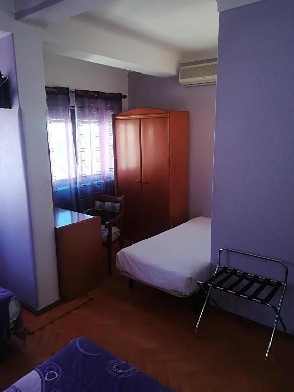 Postel nebo postele na pokoji v ubytování Hotel Conforto Latino