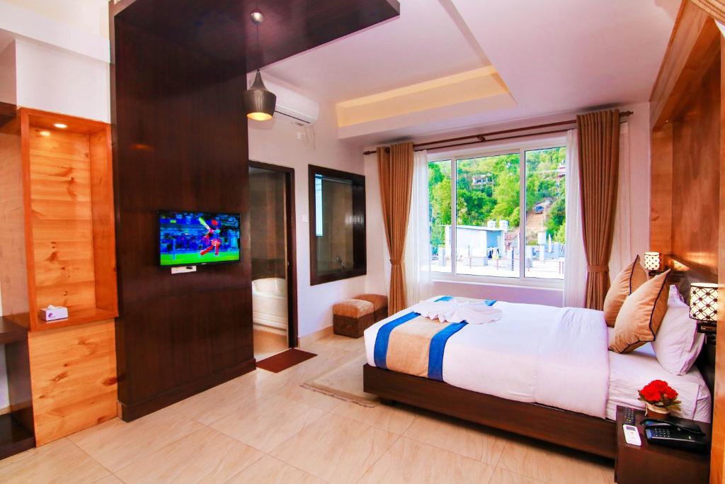 Katil atau katil-katil dalam bilik di Hotel Lake Paradise