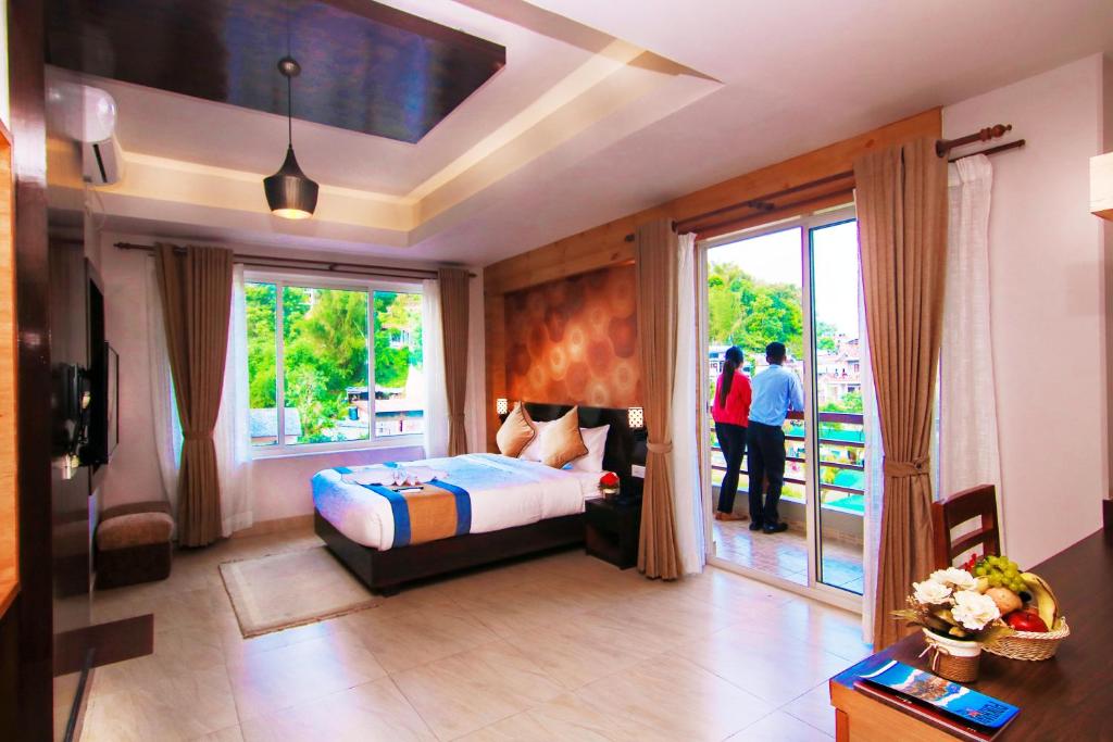 Katil atau katil-katil dalam bilik di Hotel Lake Paradise
