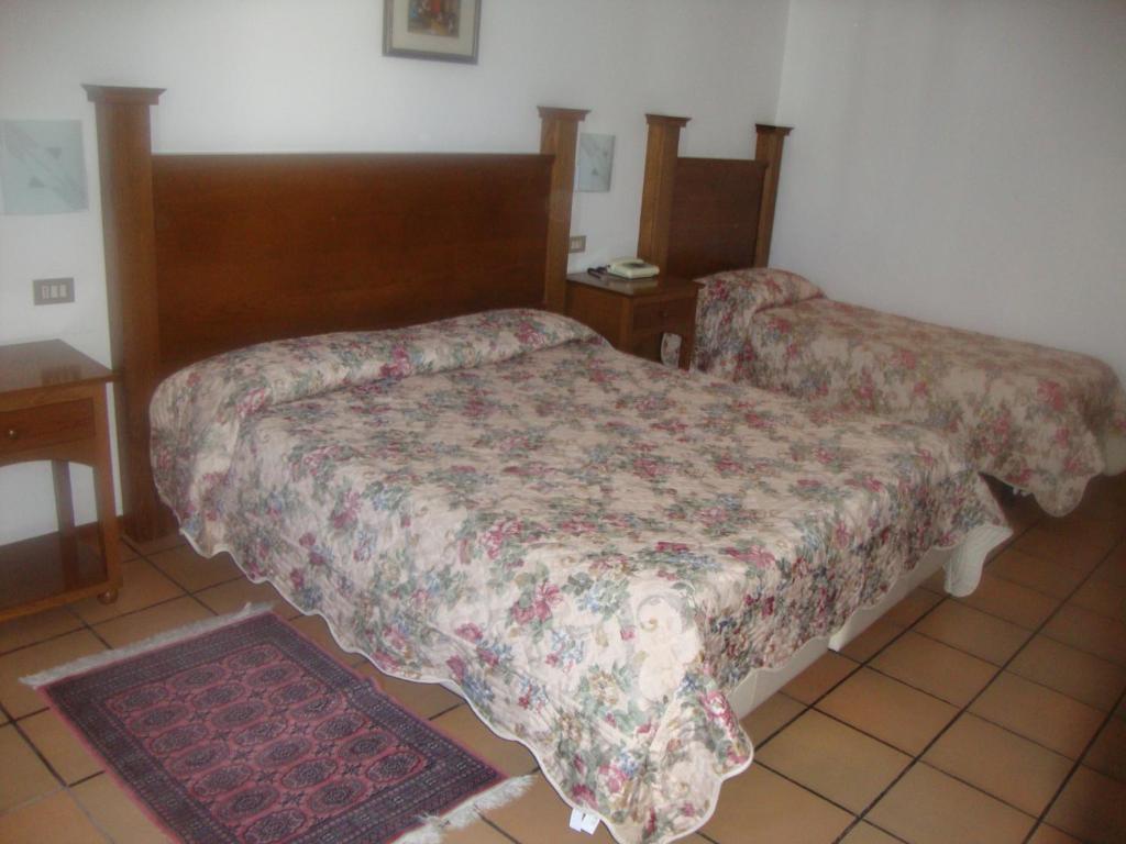 Postel nebo postele na pokoji v ubytování Hotel Cristal