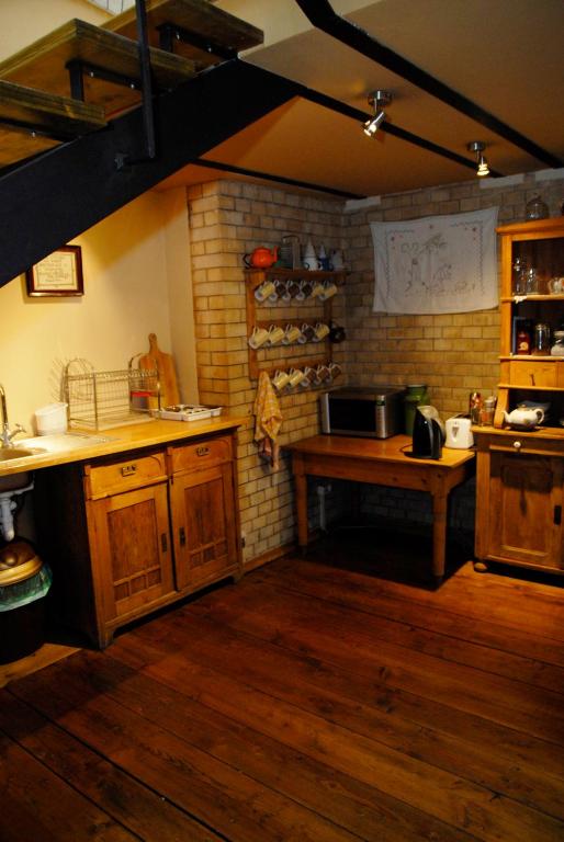 Kuchyň nebo kuchyňský kout v ubytování Hostel, Pokoje gościnne Mleczarnia - Ozonowane