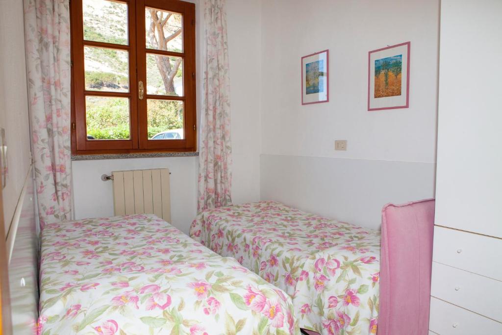 Postel nebo postele na pokoji v ubytování Casa Danilo