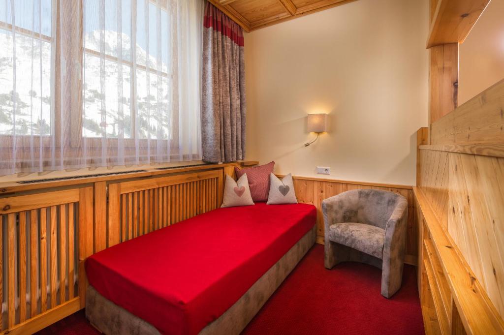 Postel nebo postele na pokoji v ubytování Hotel Garni Haus Tyrol