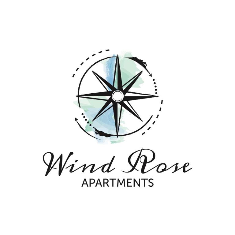 a logo for a windro apartment building with a compass at Wind Rose Apartments in Nago-Torbole