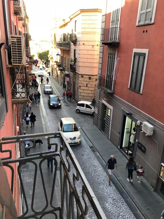 a view of a city street with cars and people at Sweet home Pozzuoli in Pozzuoli