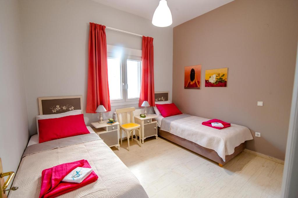 Postel nebo postele na pokoji v ubytování Skandalakis Homes & Apartments