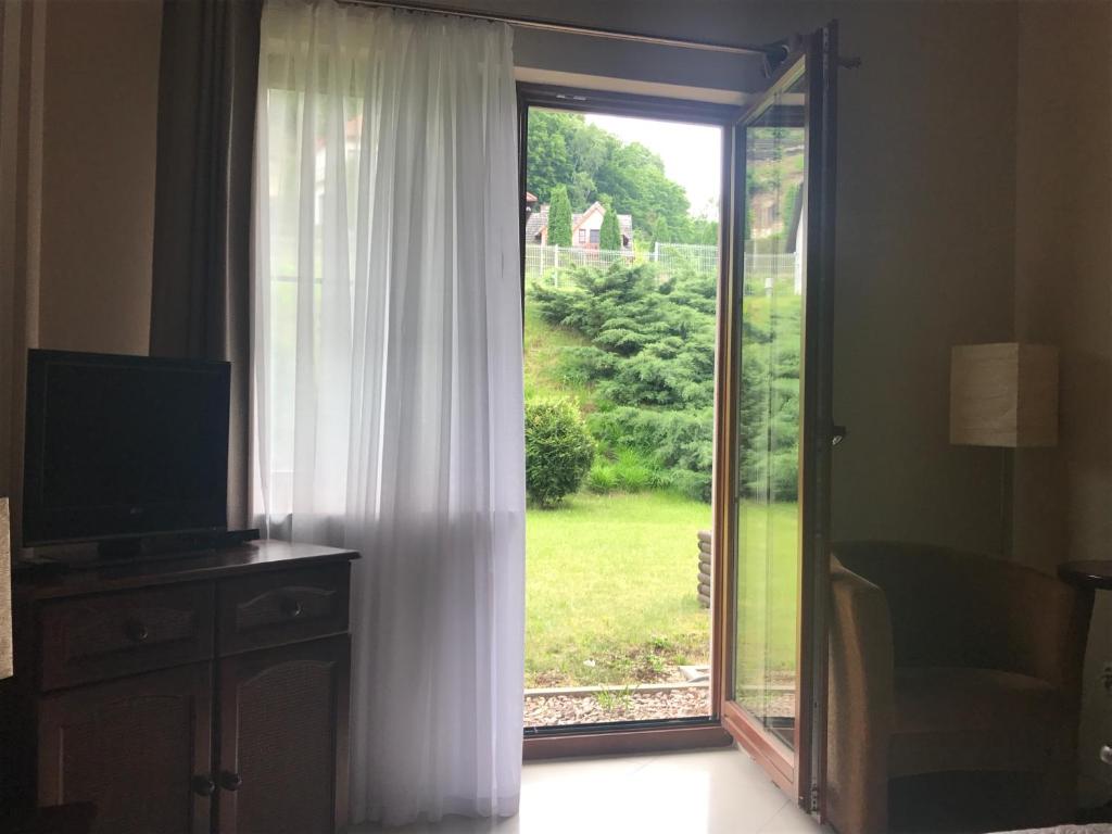 Vonkajšia záhrada v ubytovaní Apartament 6 Cappucino Pod Aniołem