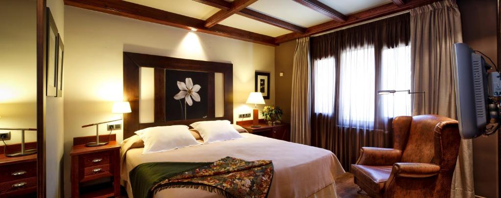 Postel nebo postele na pokoji v ubytování Hotel Ciria