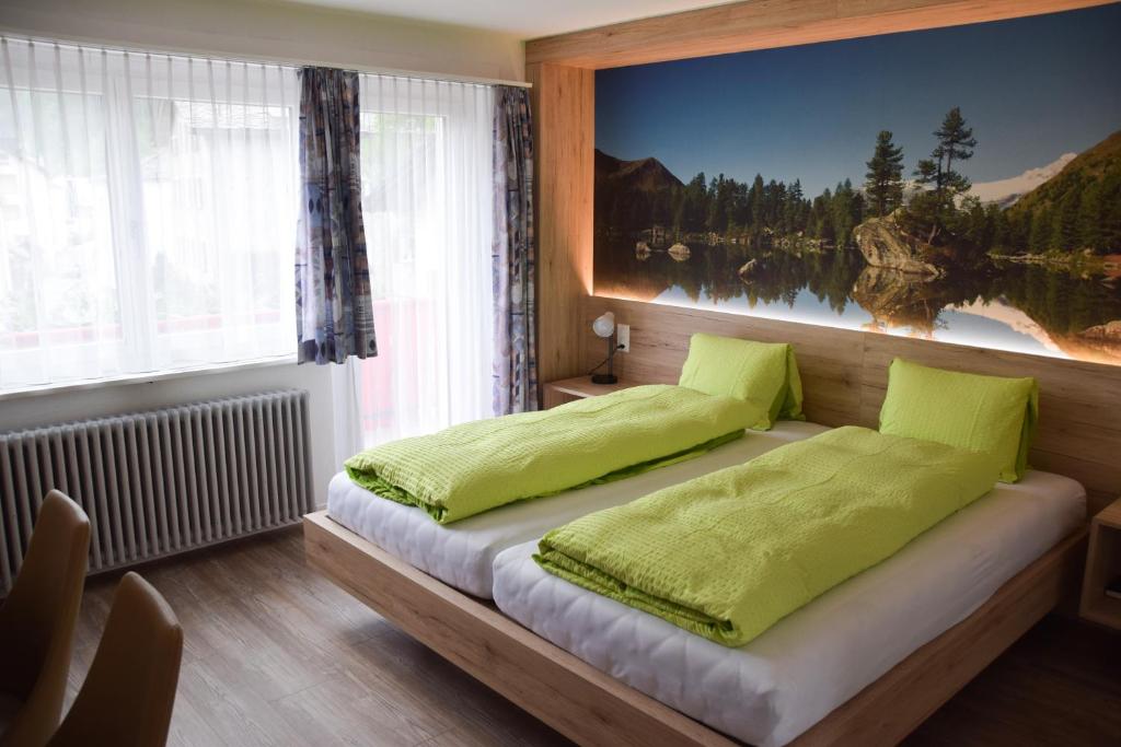 Postel nebo postele na pokoji v ubytování Hotel Posta