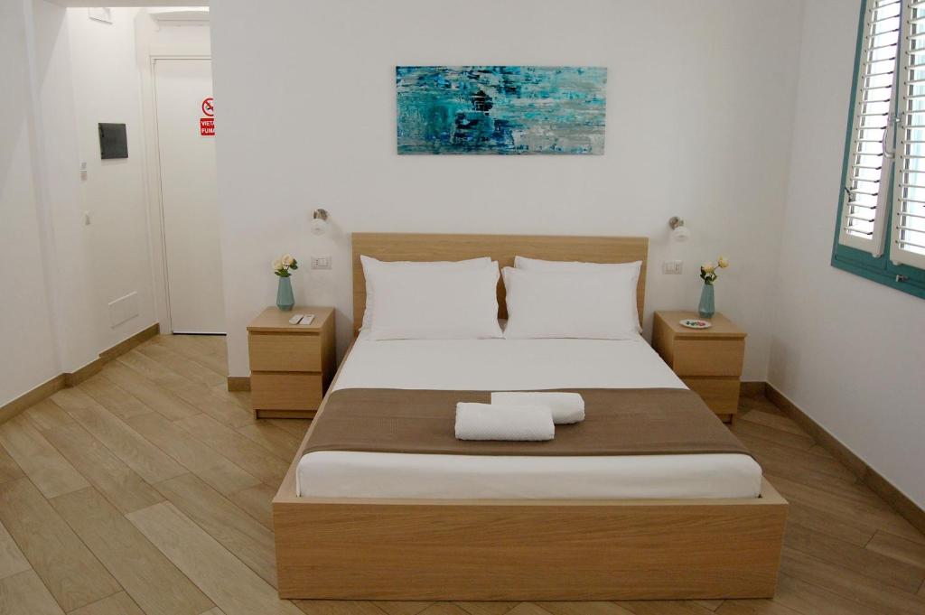 Postel nebo postele na pokoji v ubytování B&B Mormina