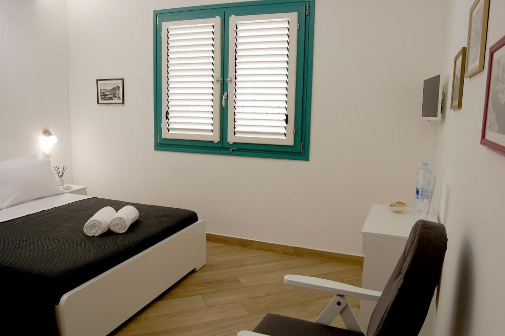 Postel nebo postele na pokoji v ubytování B&B Mormina