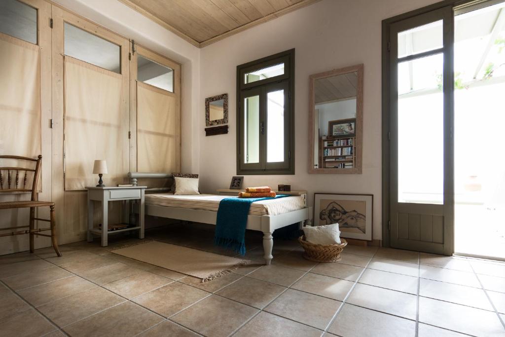 Postel nebo postele na pokoji v ubytování Plori House