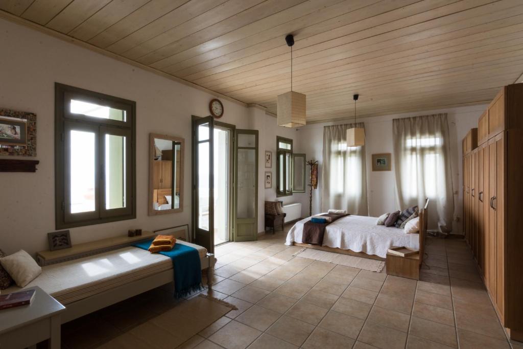 Postel nebo postele na pokoji v ubytování Plori House