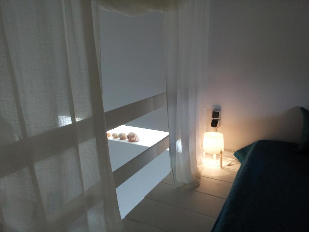 Postel nebo postele na pokoji v ubytování Plori House