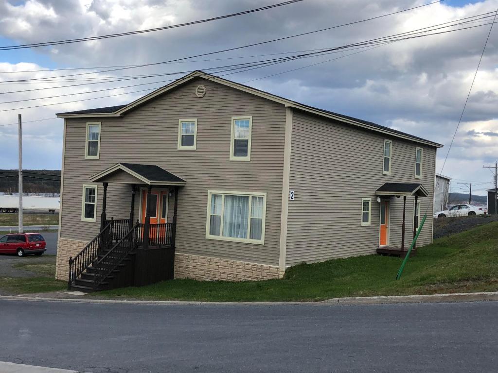 a house on the side of a street with at Stanley House in Clarenville