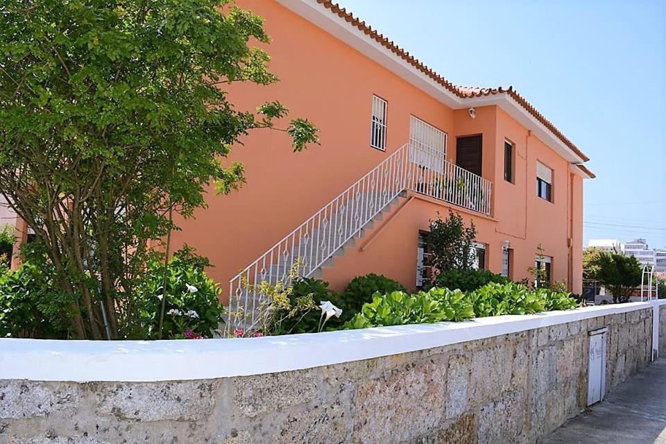 a house with a staircase in front of it at Casa Praia Norte - PVZ in Póvoa de Varzim