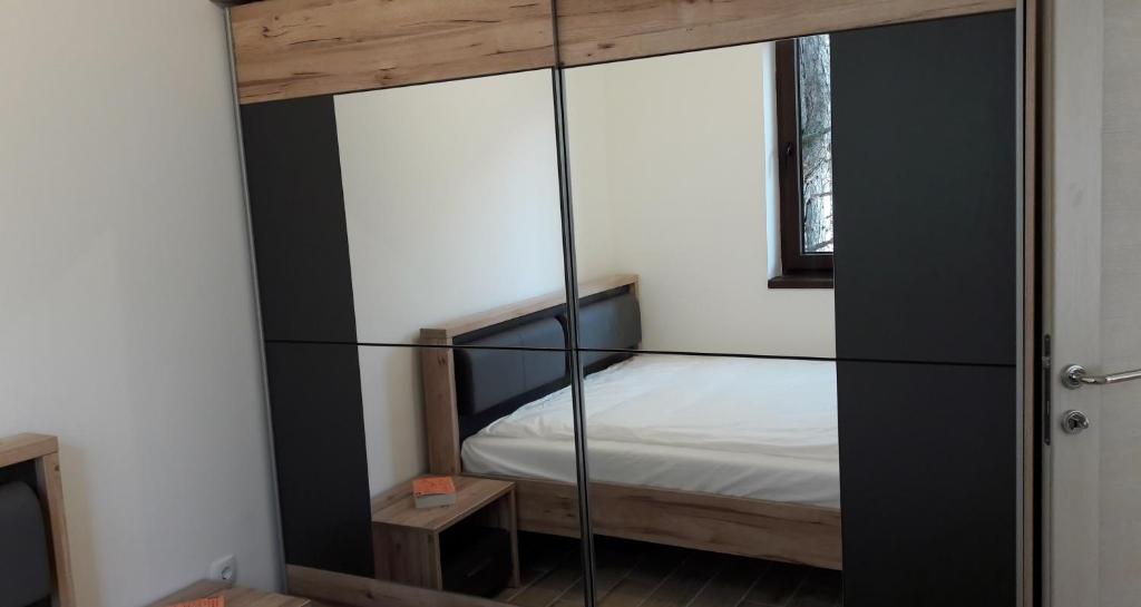 Postel nebo postele na pokoji v ubytování Zlatibor Wood