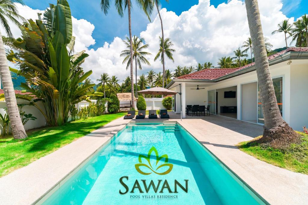 a villa with a swimming pool in front of a villa at SAWAN Residence Pool Villas in Lamai