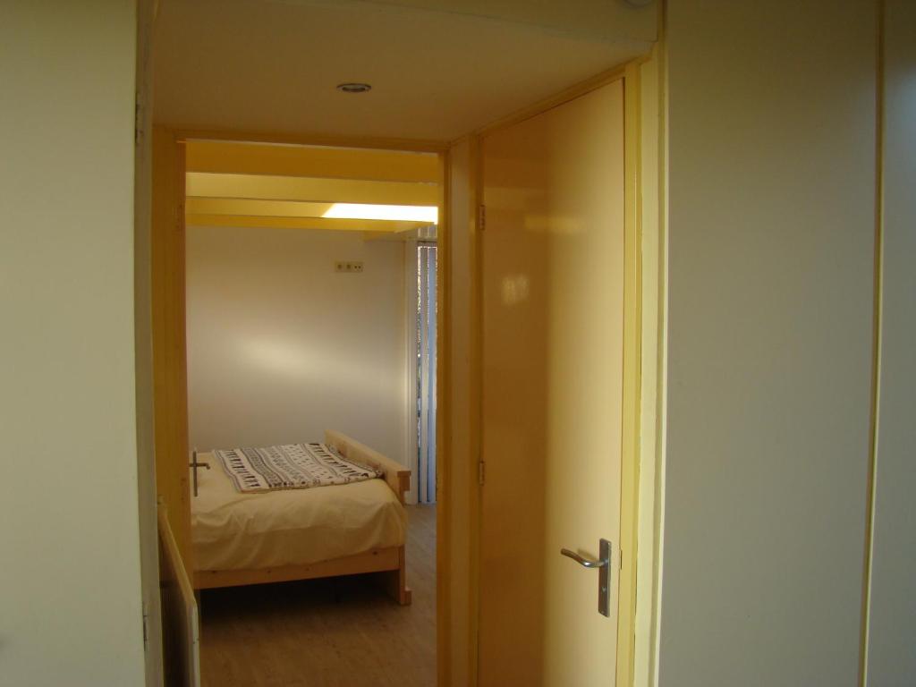 Postel nebo postele na pokoji v ubytování B&B Zuiderkreek
