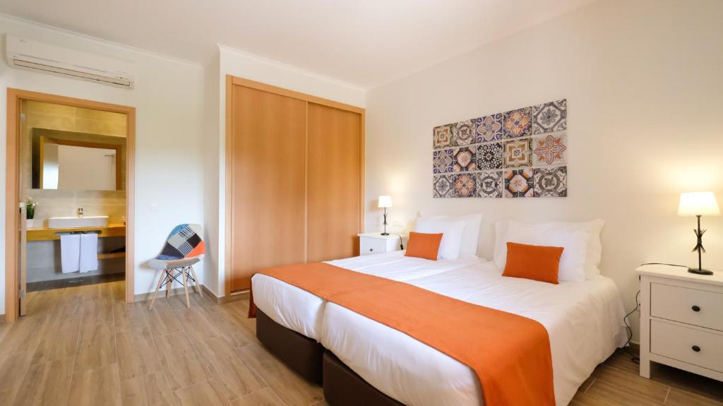 Cama ou camas em um quarto em Quinta dos Poetas Nature Hotel & Apartments