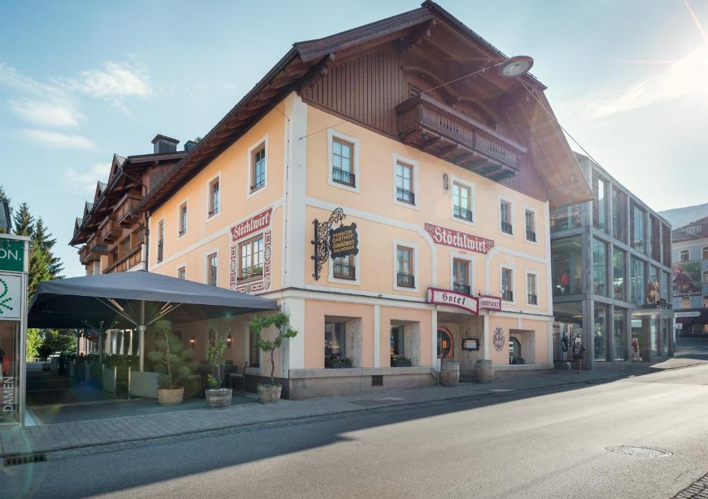a large building on the side of a street at Hotel Restaurant Stöcklwirt in Sankt Johann im Pongau